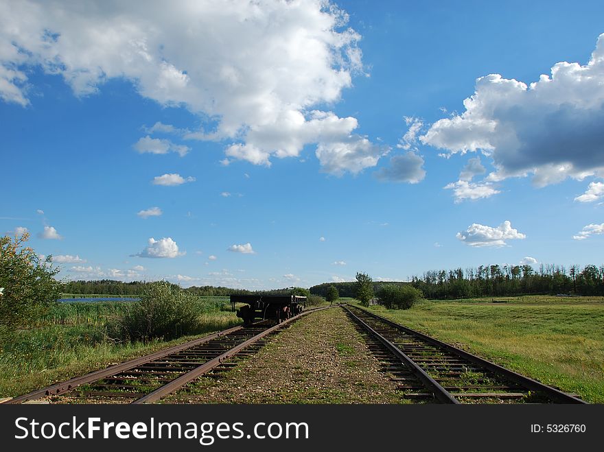 Railway to the end under blue sky. Railway to the end under blue sky