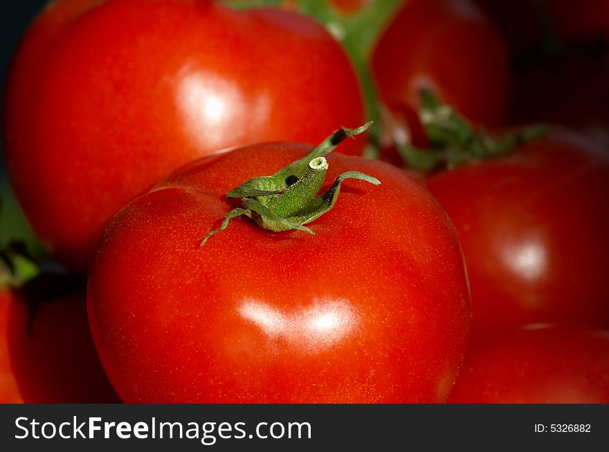 Fresh ripe tomatoes macro closeup, selective focus