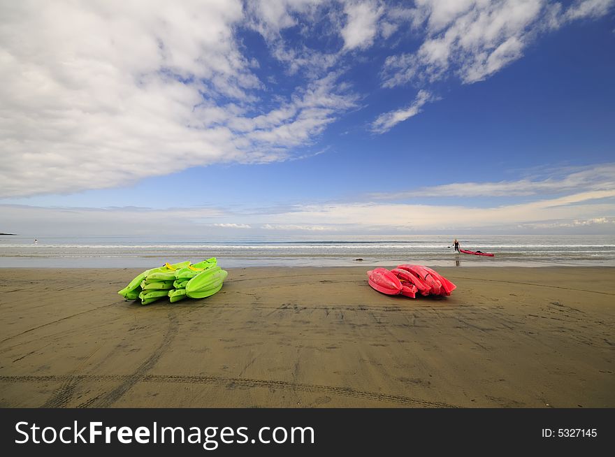 Colorful kayaks lay on the beach. Colorful kayaks lay on the beach