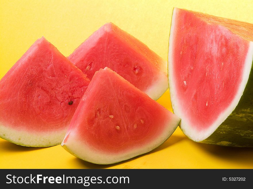 Juicy watermelon in yellow background. Juicy watermelon in yellow background