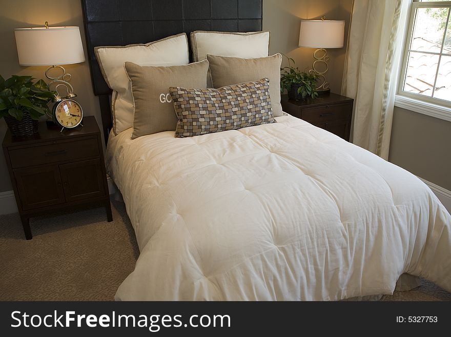 Designer bedroom with contemporary furniture and decor. Designer bedroom with contemporary furniture and decor.