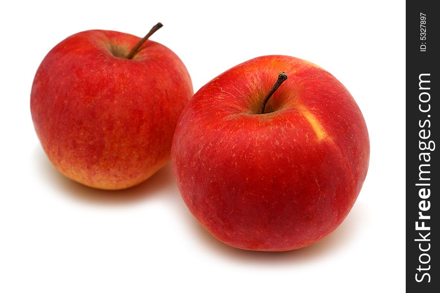 Two red bright apples isolated on white