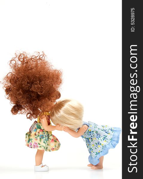 Doll cries. Her girlfriend spared. Isolated on a white background.