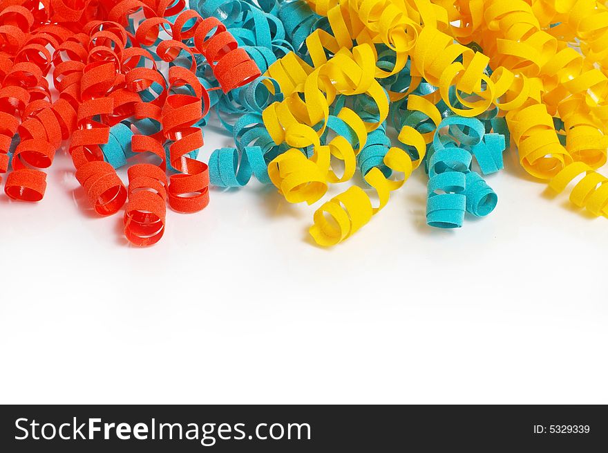 Color tinsel on a white background, across