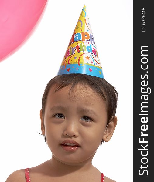 Little girl looking up with the balloon