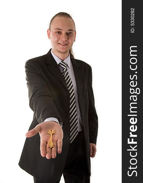 Businessman holding key isolated on white background
