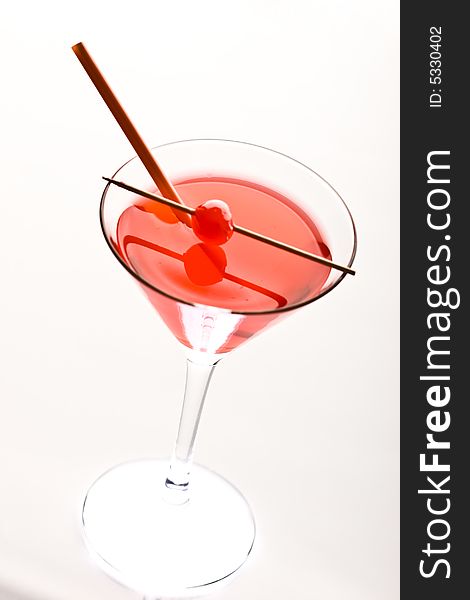 Drink series: red cocktail and cherry with straw. Drink series: red cocktail and cherry with straw
