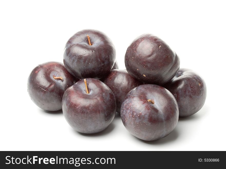 Fresh plums isolated on a white background