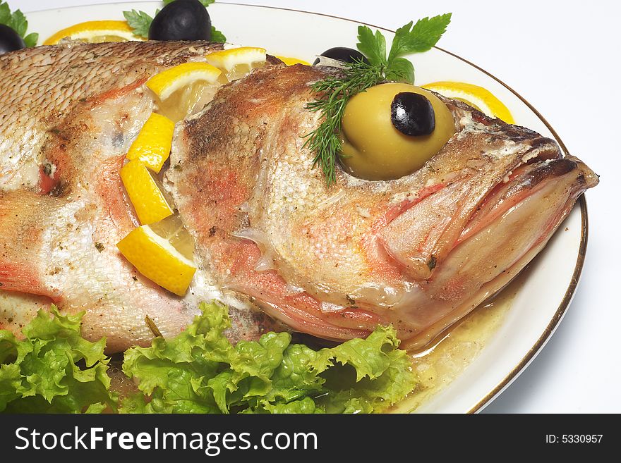 Baked perch fish with salad isolated. Baked perch fish with salad isolated