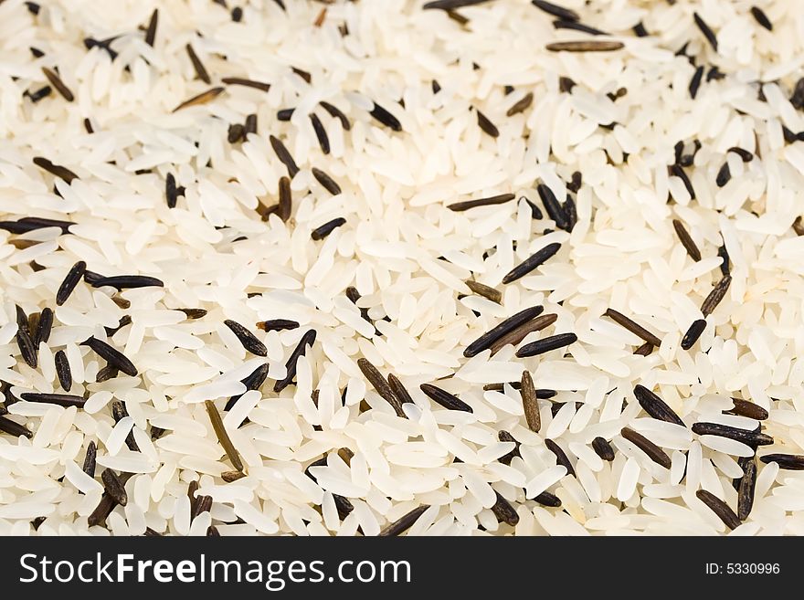 Background from a raw rice. Close up. Background from a raw rice. Close up.