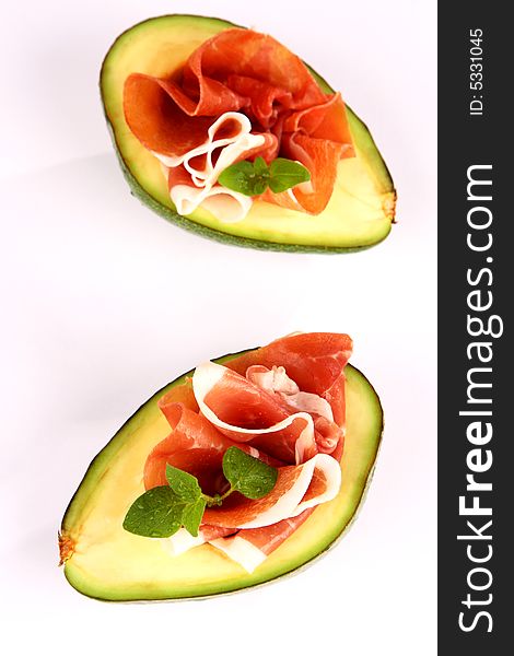 Fresh avocado with tasty ham