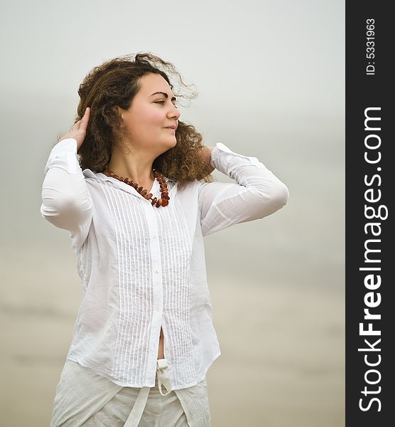 Portrait of attractive young woman on the beach