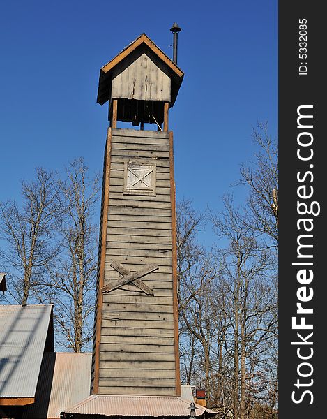 Rural wooden tower against a blue sky