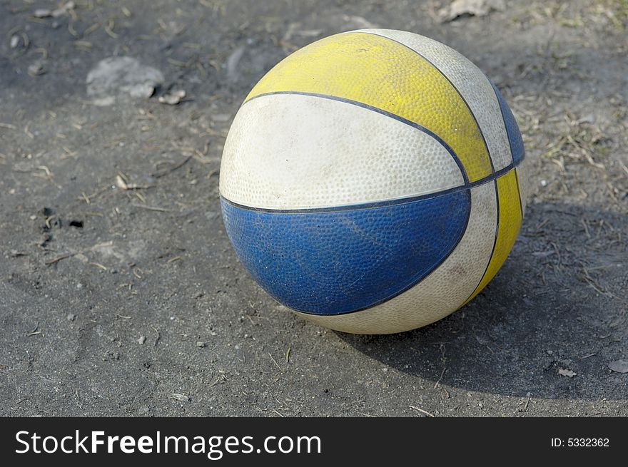 Photo of child's toy ball rolling on the ground