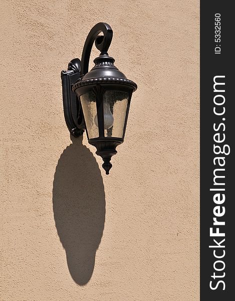 Lantern with shadow with stucco wall. Lantern with shadow with stucco wall