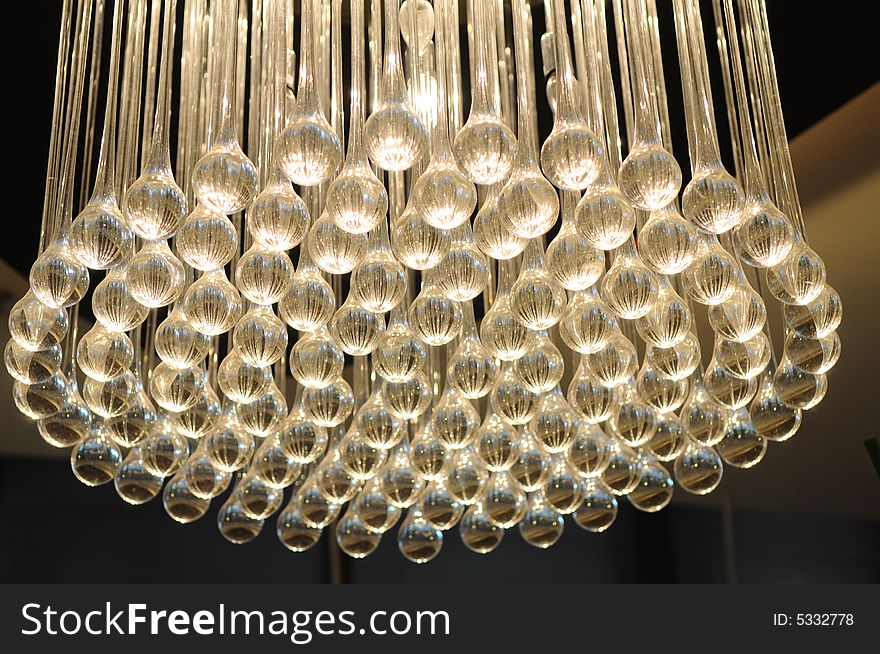 The peculiar shaped pendent lamp made of many glass tubes. The peculiar shaped pendent lamp made of many glass tubes.