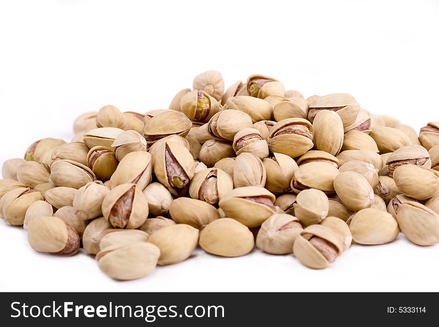 Isolated pistachios on a white background