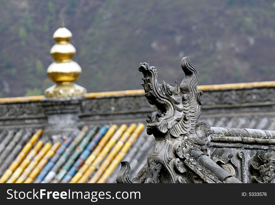 Exquisite eave and ornamental on the roof of ancient temple.