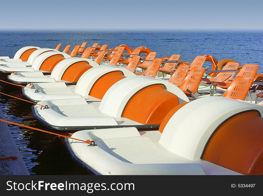 Colorful Catamarans On Leash