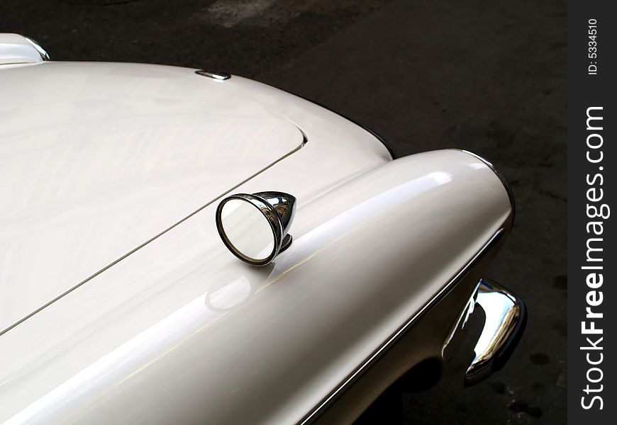 An old white car's hood.