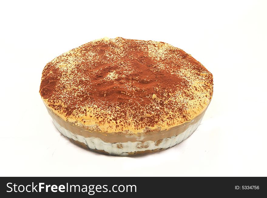 Pie of the home preparation with cinnamon additive on white background