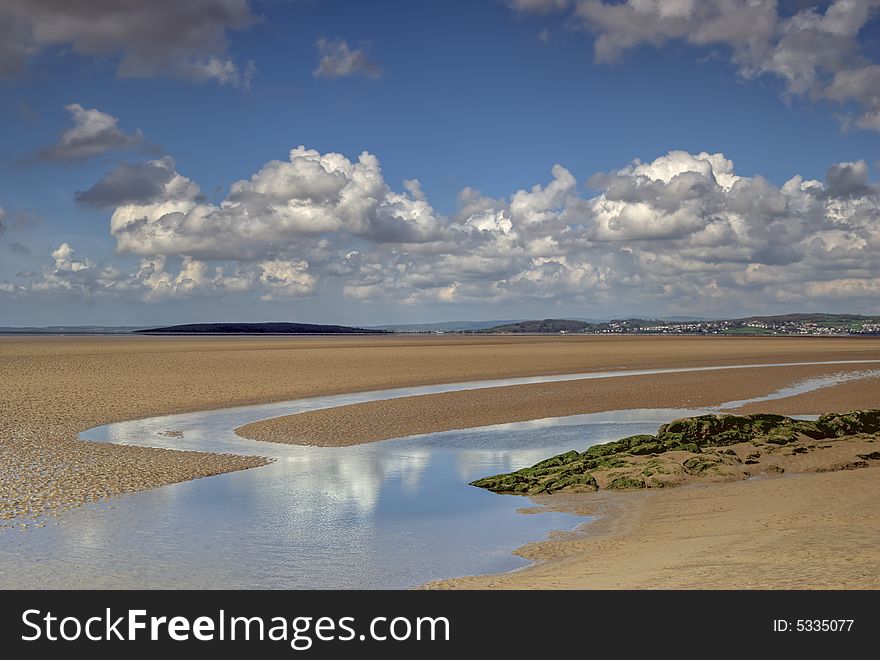 Sand at low tide in the Morcambe Bay estuary at low tide. Sand at low tide in the Morcambe Bay estuary at low tide