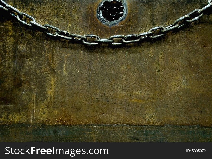Chain hanging on a box with chains inside. Chain hanging on a box with chains inside.