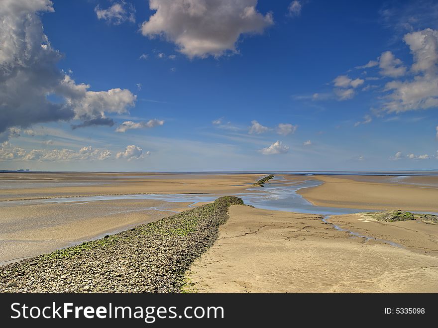 Sand at low tide in the Morcambe Bay estuary at low tide. Sand at low tide in the Morcambe Bay estuary at low tide