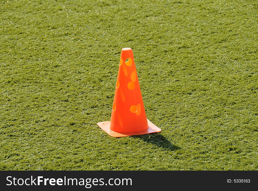 Training cone on an all weather pitch