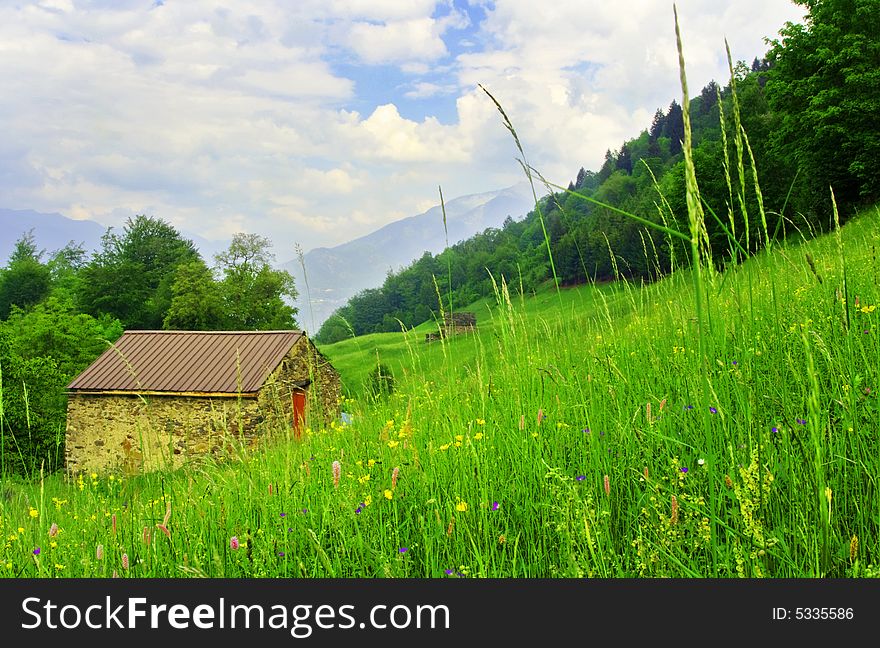 Mountain house in the middle of the lawn. Mountain house in the middle of the lawn