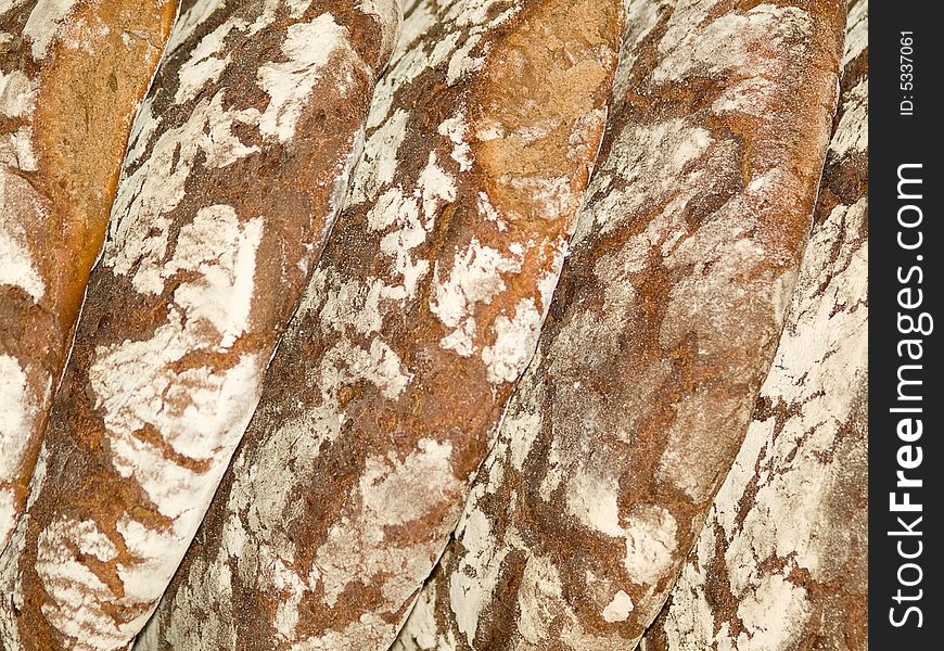 Brown bread round loafs background. Brown bread round loafs background