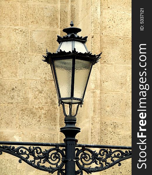 Old lamp and brick wall at Maillorca, Spain