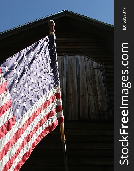 American Flag Hanging From English Barn