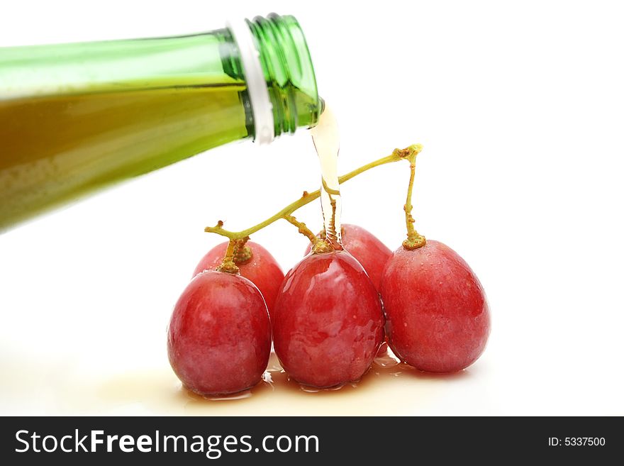 Wine pouring on a string of grapes. Wine pouring on a string of grapes.