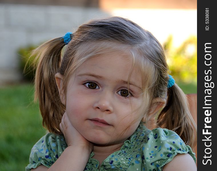 Little Girl With Pony Tails Listening