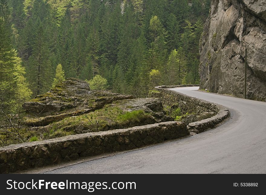 Road curve in Bicaz Canyon one of the most exciting travel road in Romania. Road curve in Bicaz Canyon one of the most exciting travel road in Romania.