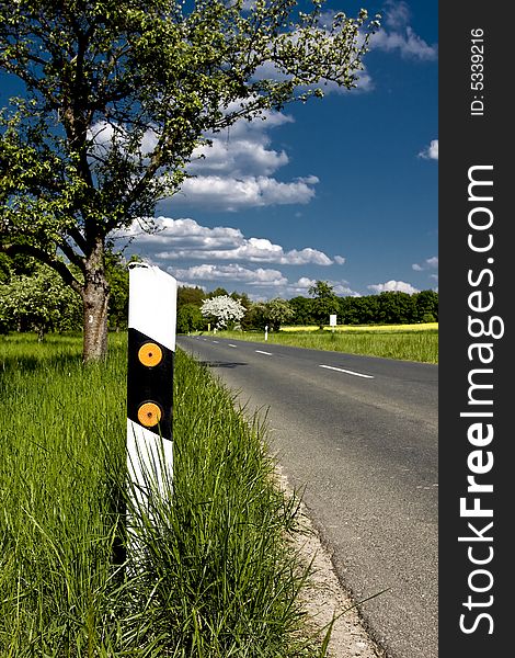 Lonely country road in the franconian country side in germany. Lonely country road in the franconian country side in germany