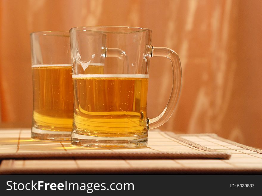 Friendly party around a beer mug. Friendly party around a beer mug
