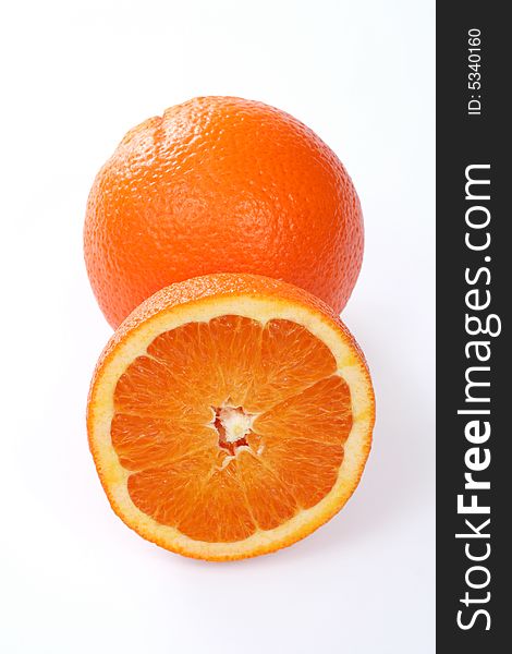 One and half orange isolated on white background