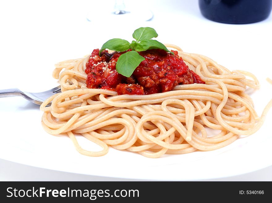 Spaghetti bolognese served on white plate. Spaghetti bolognese served on white plate