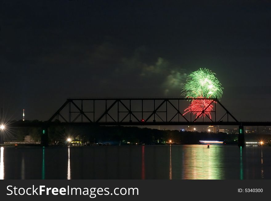 Firework and reflection on water