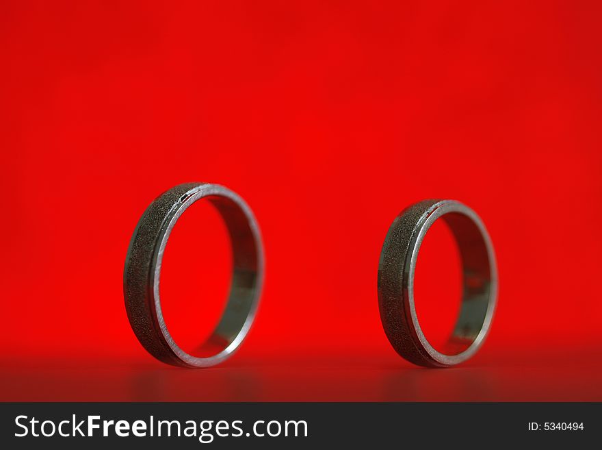 A simple red  background-texture taken with wedding ring. A simple red  background-texture taken with wedding ring