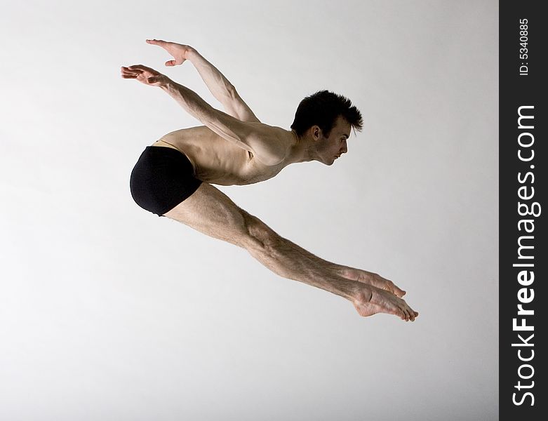 Young professional male dancer leaping. Young professional male dancer leaping
