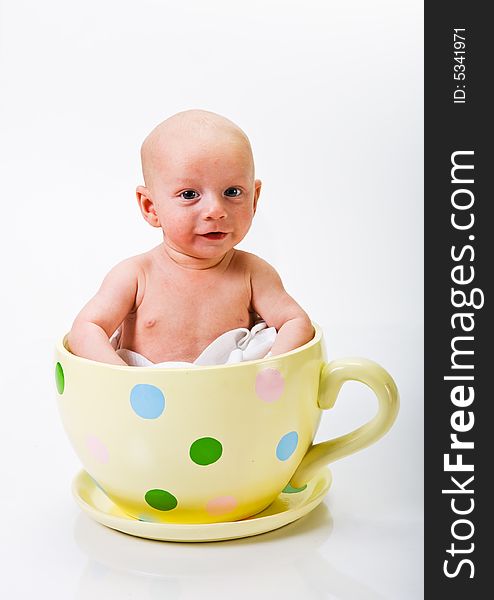 Baby In Yellow Spotted Cup