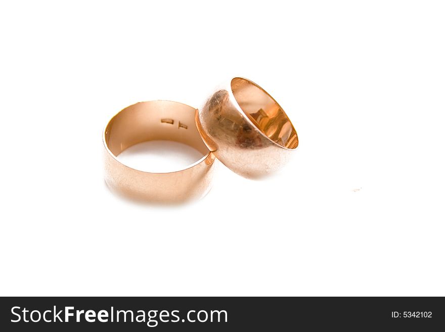 Golden wedding rings isolated on white. Golden wedding rings isolated on white