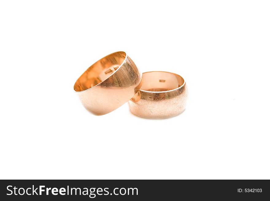 Golden wedding rings isolated on white. Golden wedding rings isolated on white