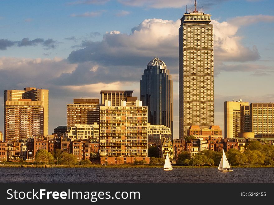 A couple of sailboats on the Charles River in the late afternoon near Boston's Back Bay.