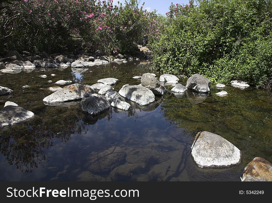 Small pond in a granite channel of a mountain stream