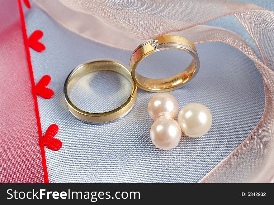Wedding rings on a blue background