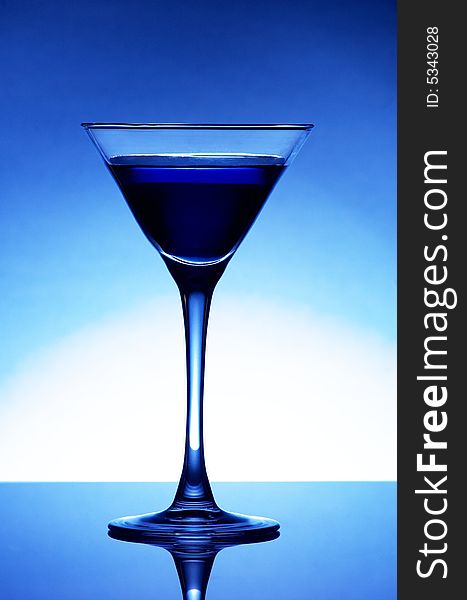 Martini glass with blue cocktail. Martini glass with blue cocktail